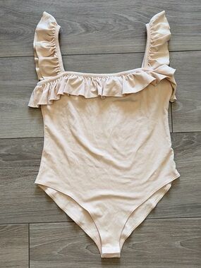 Ruffled One-Piece Bodysuit in Light Beige